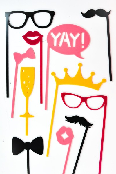 Yellow, pink and black booth props made with a glowforge.